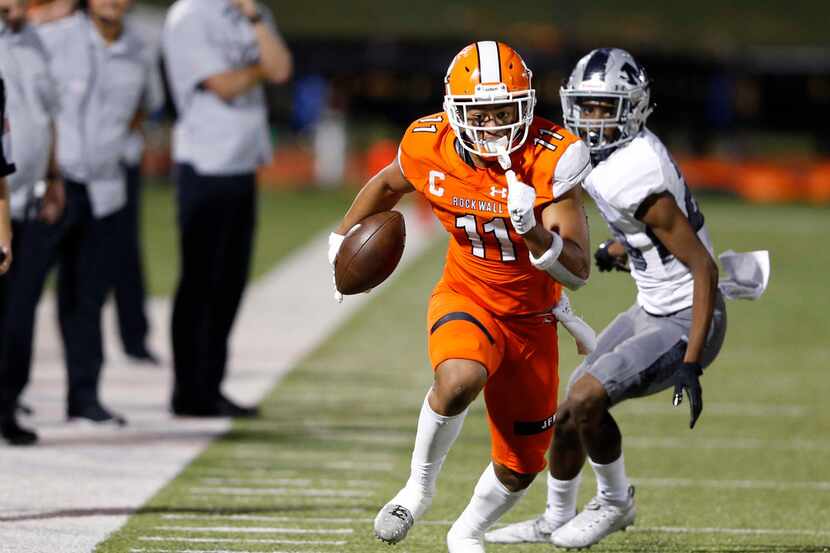Rockwall wide receiver Jaxon Smith-Njigba (11) runs up the field after a catch during...