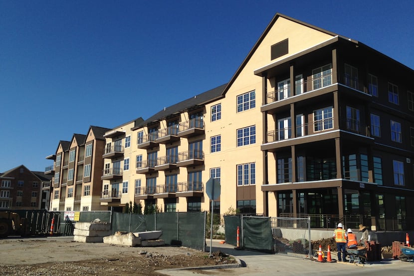 Construction crews are finishing up construction on the first phase of apartments in the...