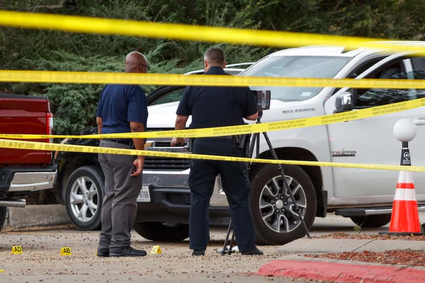 Mesquite police officers investigate the scene of a fatal shooting Friday.