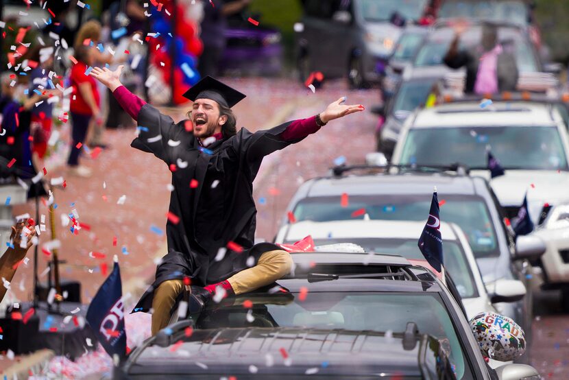 Graduate William Santini celebrated as confetti fell during a commencement car parade at...