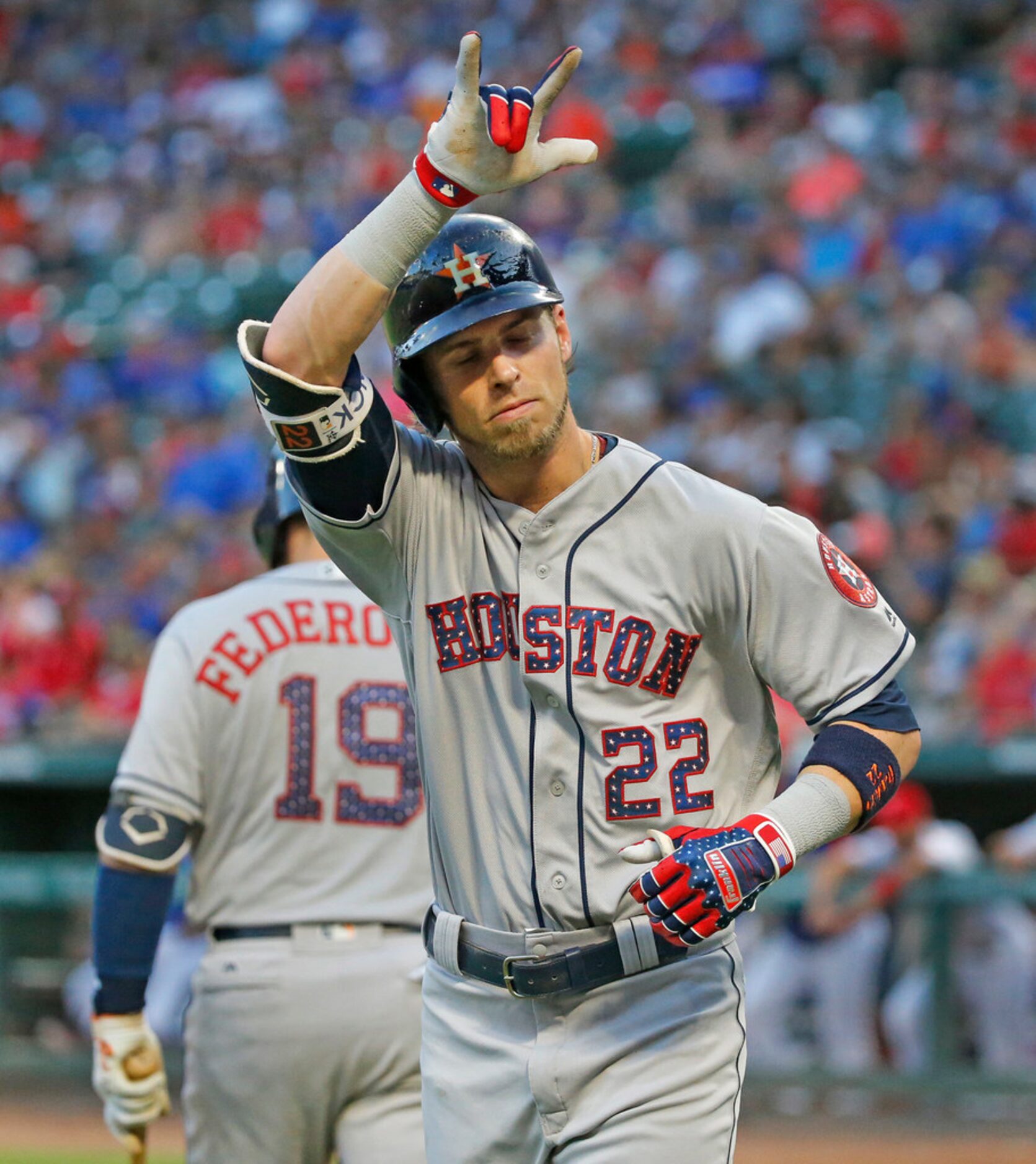 Houston Astros Josh Reddick (22) gestures to the crowd after homering in the third inning...