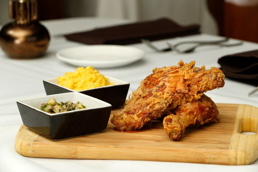 Fried chicken served with corn puree and tomatillo salsa at Salum.