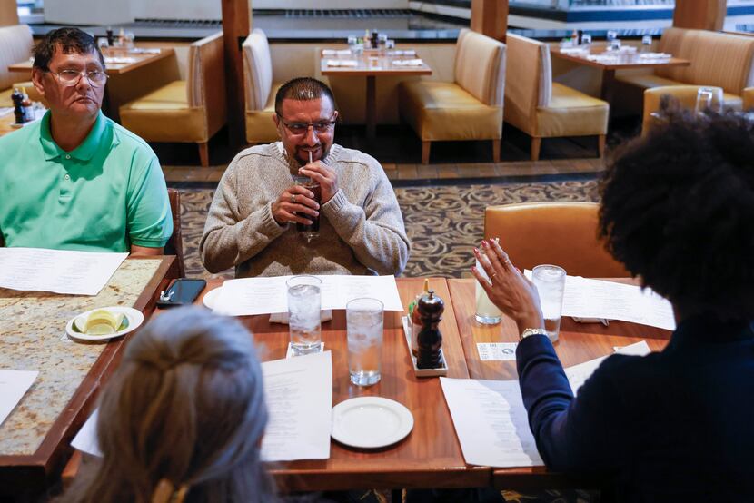 Martin Santillan sips a drink during a lunch at Hyatt Regency Dallas with friends and family...