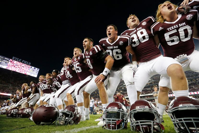 Texas A&M players including quarterback Trevor Knight (8) celebrate a 45-38 double OT win...