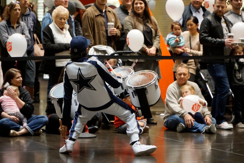 The Dallas Cowboys Rhythm & Blues Drumline performed during the Salvation Army Angel Tree...