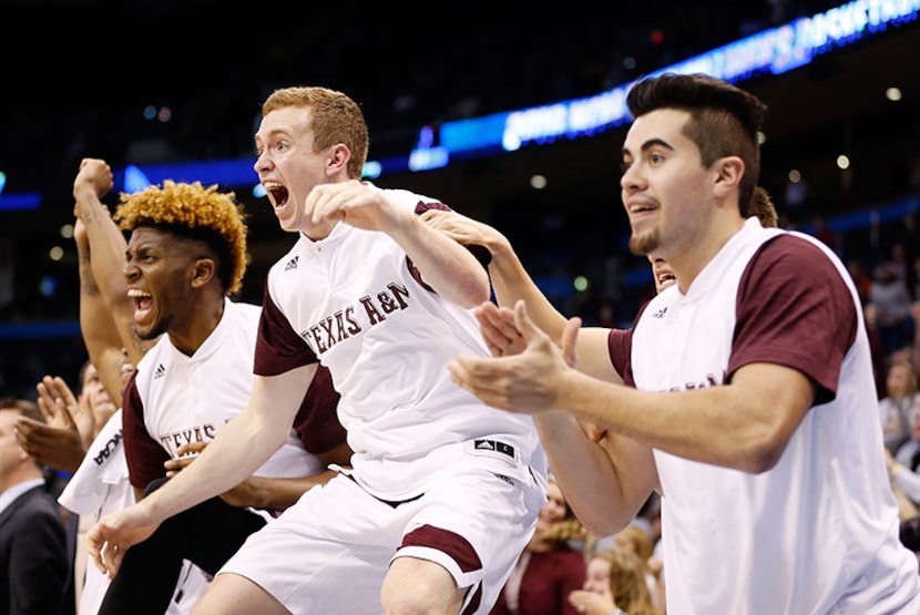  Texas A&M guard Kyle Dobbins (25) and teammates celebrate as they mount a comeback late in...