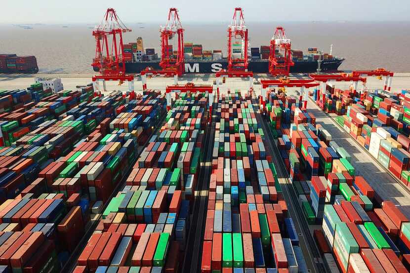 In this April 10, 2018, file photo, a cargo ship is docked at the Yangshan container port in...