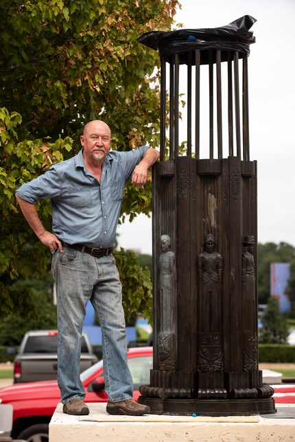 Michael Van Enter with one of the Torchiere lamps outside of the main entrance to the Hall...