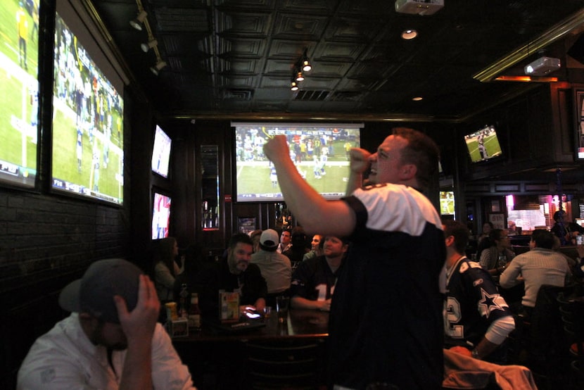 Jason Crane cheers for the Cowboys at Christie's Sports Bar during the Dallas Cowboys vs....