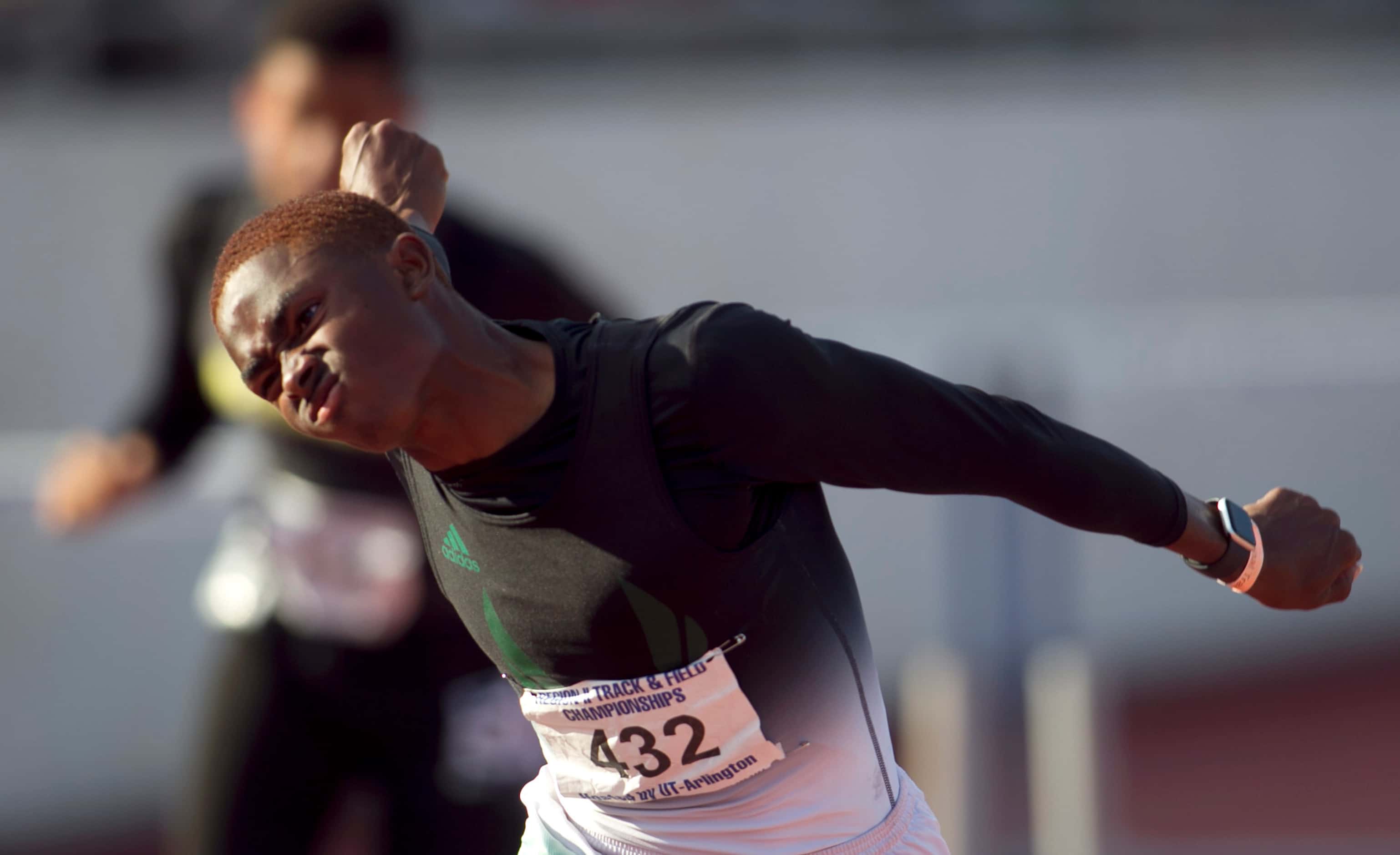 Mesquite Poteet's Kendrick Smallwood leans at the finish line to capture first place in the...