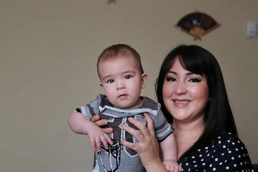 
Cassandra Lopez held her son, Everett Mashburn, in December, five years after she gave up...