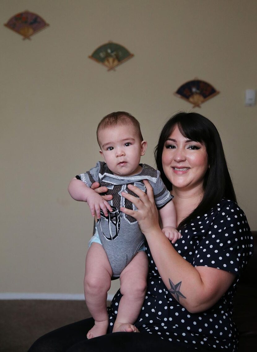 
Cassandra Lopez held her son, Everett Mashburn, in December, five years after she gave up...