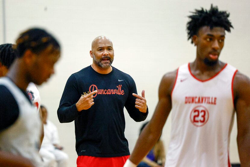 Duncanville boys head basketball coach David Peavy talks to the team during a practice,...