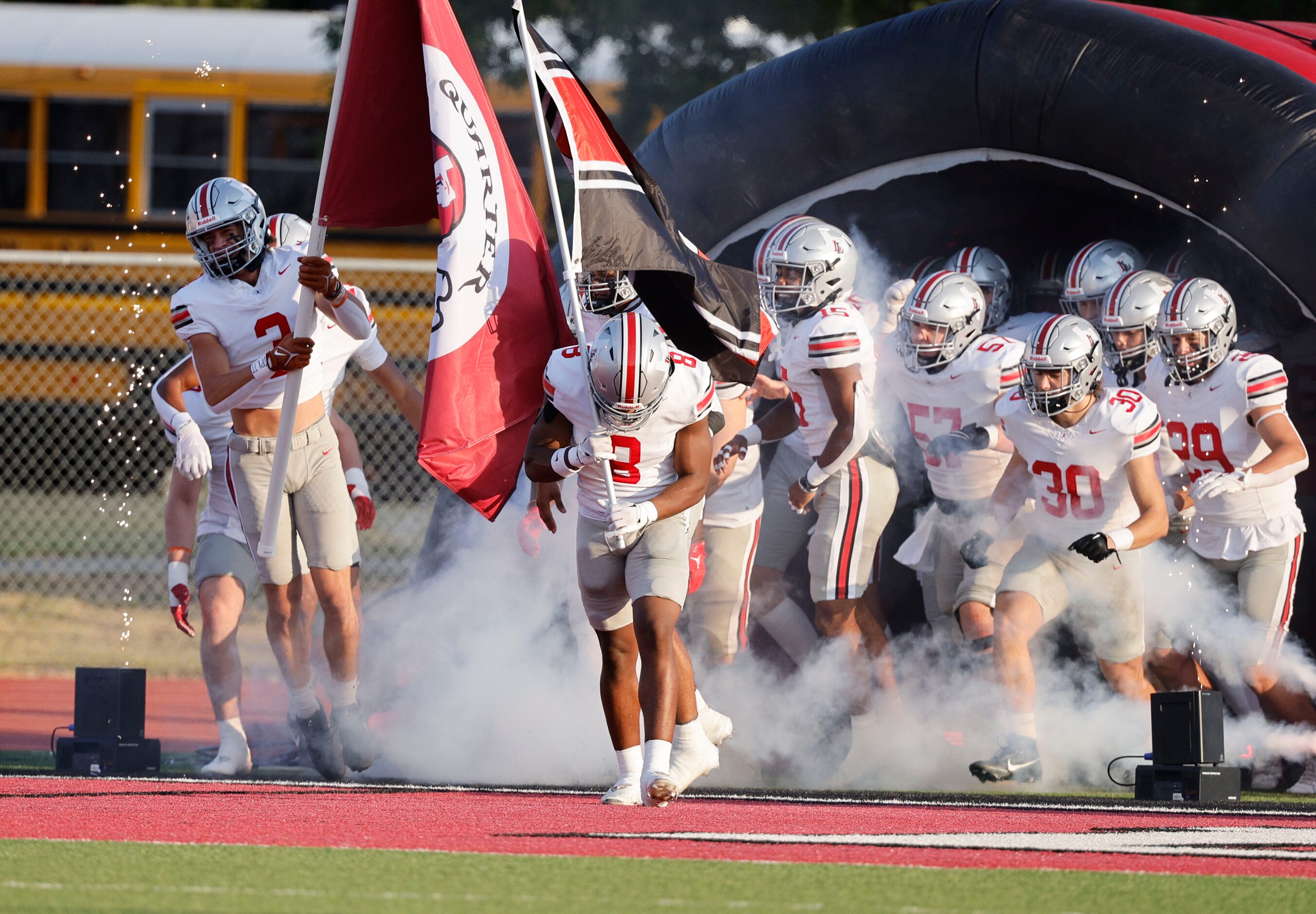 Lovejoy players run out to the field before a high school football game against Argyle at...