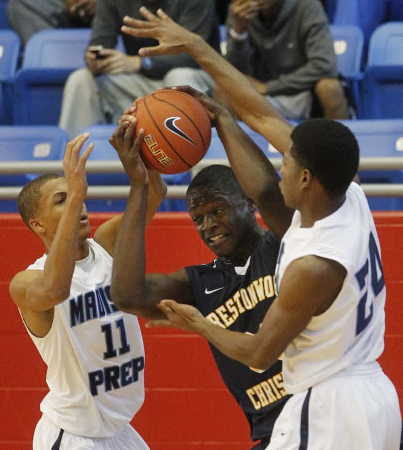 Prestonwood's Julius Randle (30) tries to get out of a double team by Madison Prep Academy's...