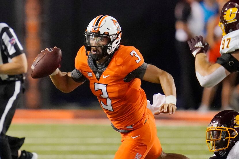 Oklahoma State quarterback Spencer Sanders (3) scrambles during the second half of the...