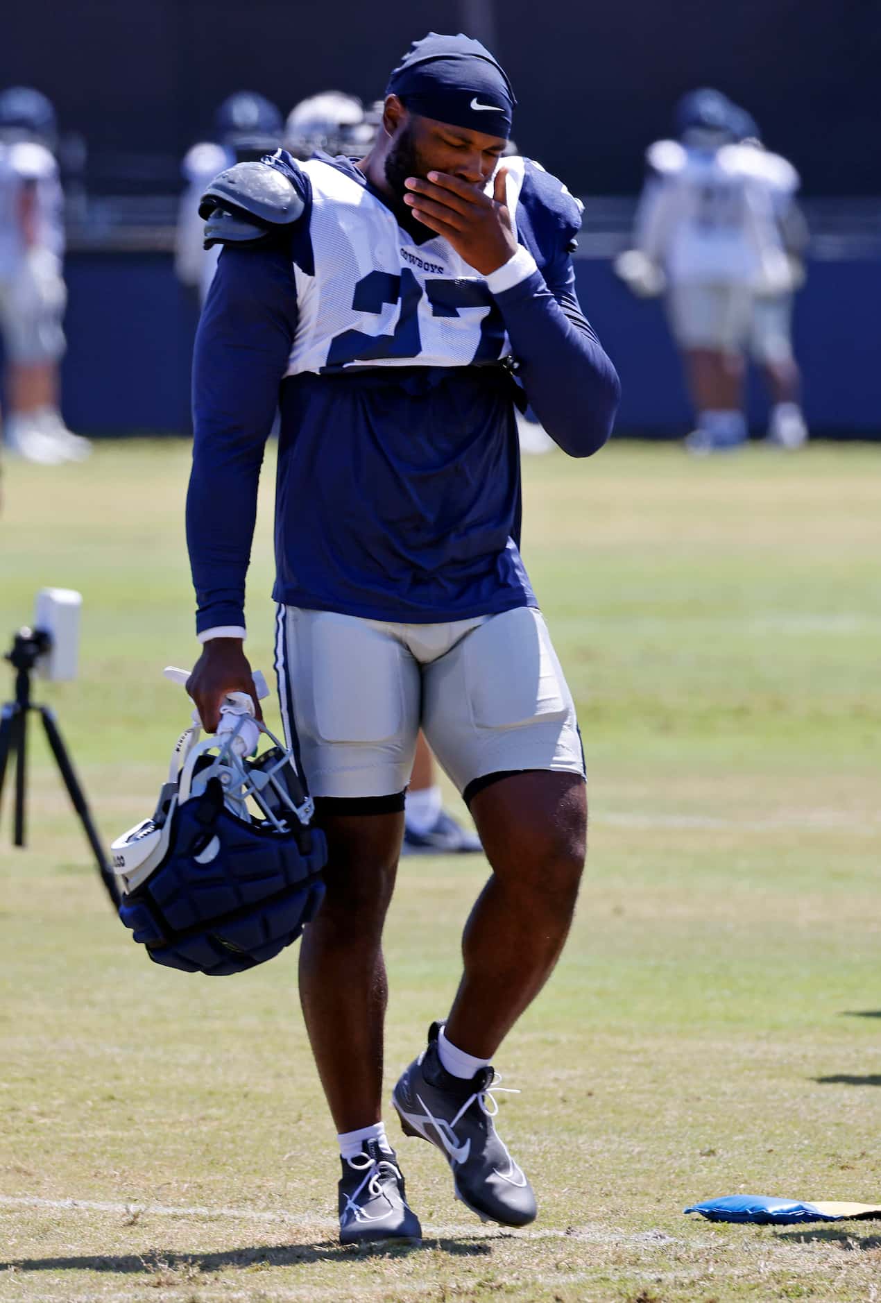 Dallas Cowboys running back Royce Freeman (27) walks to the medical tent after sustaining an...