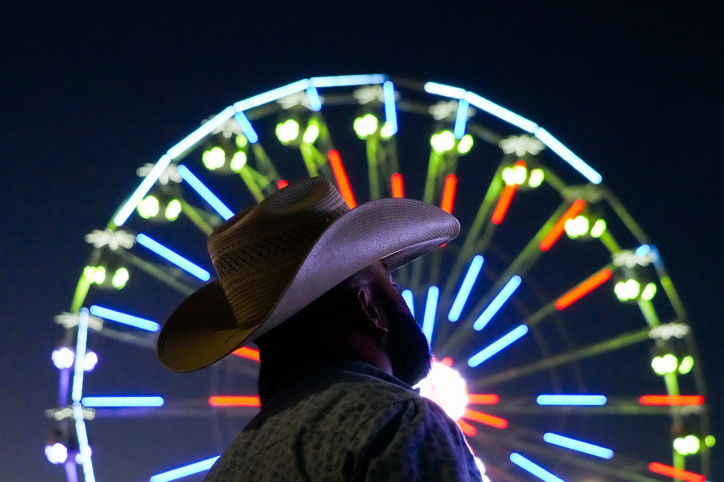 Fairgoers wait for Los Pescadores to appear on the Chevrolet Main Stage at the State Fair of...