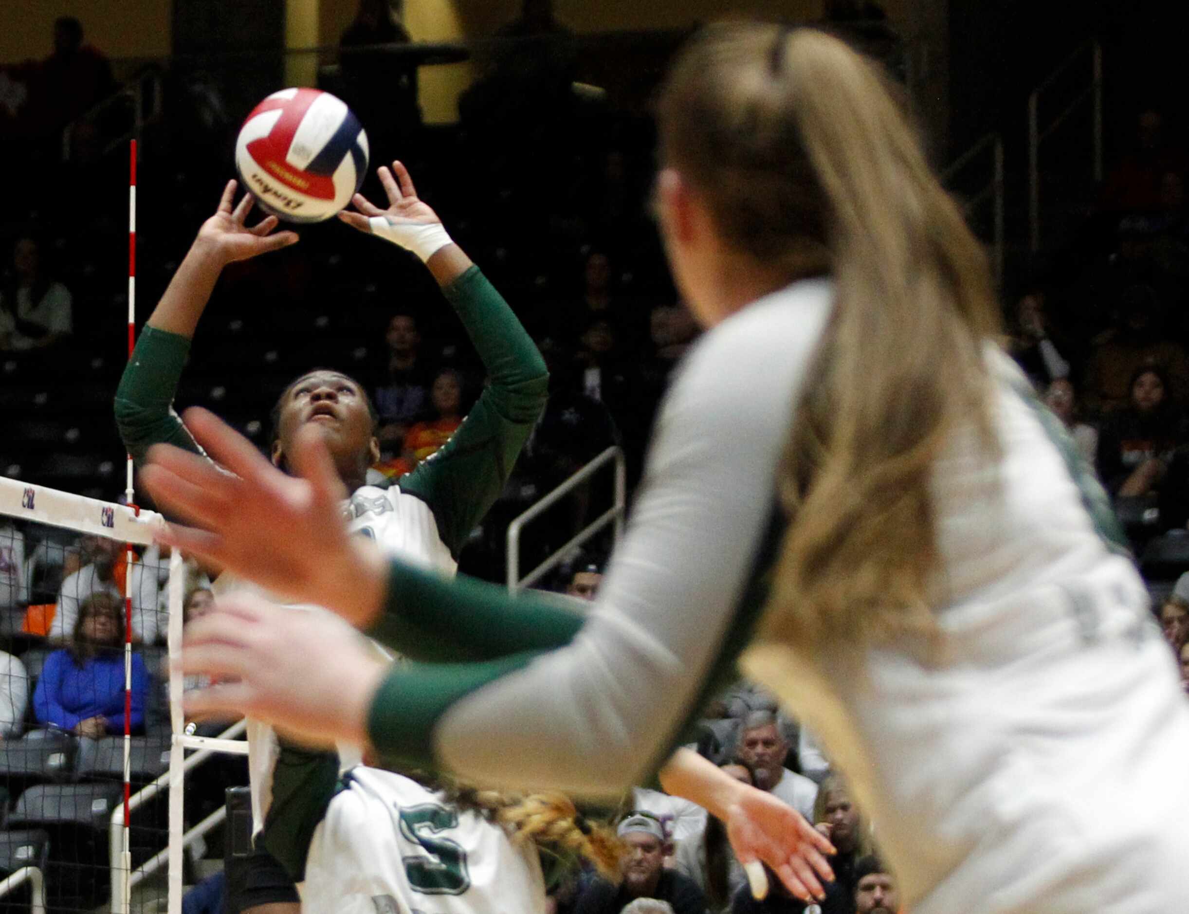 Prosper junior Hannah Beauford (10) skies to set a teammate during the second set of their...