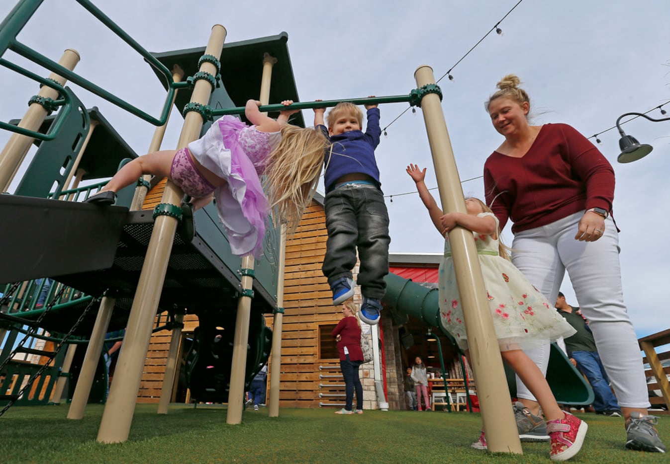 Rebecca Priddy, right, and her children Grace, 5, left, Jacob, 2, second from left, and...