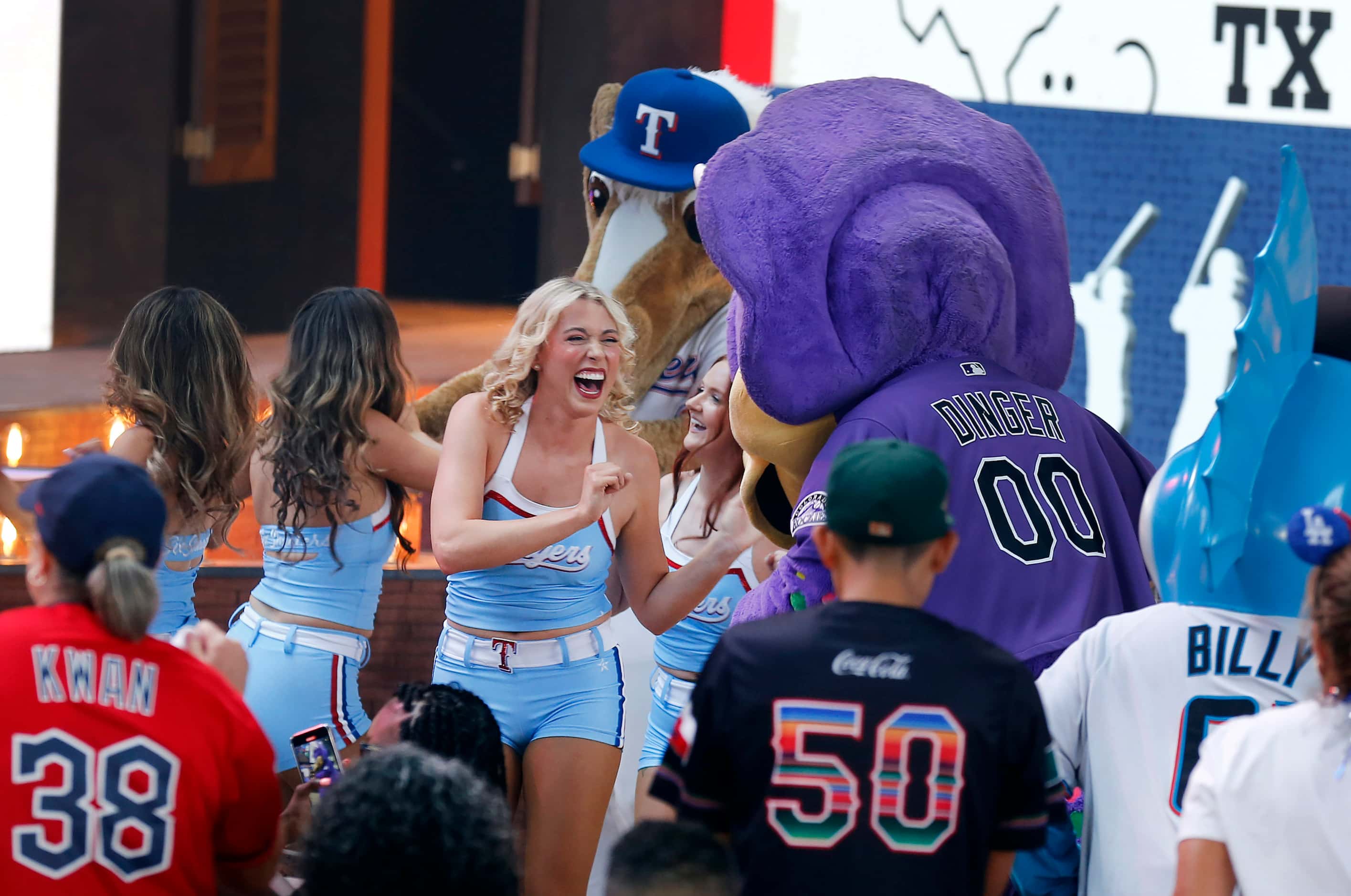 The Texas Rangers Six Shooters dance squad dance with the major league mascots during Day 1...