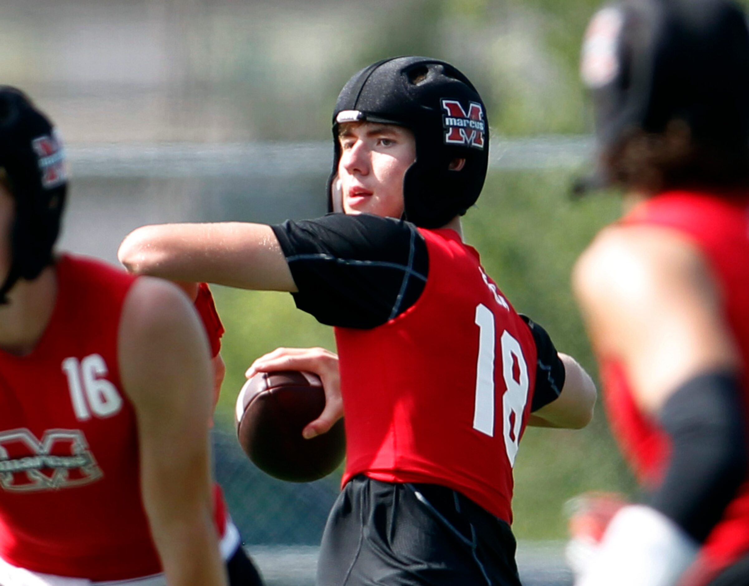 Flower Mound Marcus quarterback Cole Welliver (18) completes a short crossing route during...