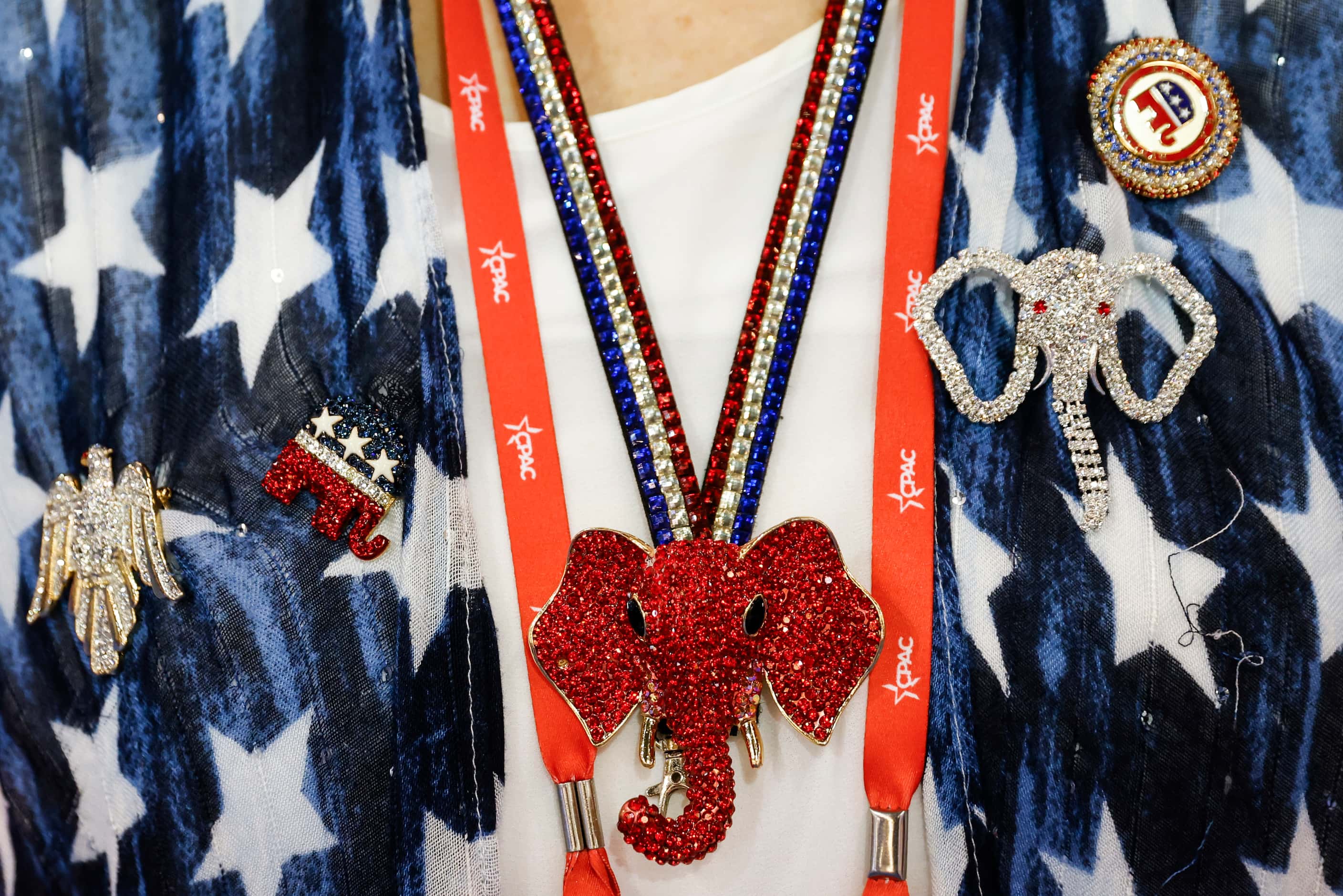 Ornaments hang on the attire of attendee Dottie Layman during the third day of Conservative...