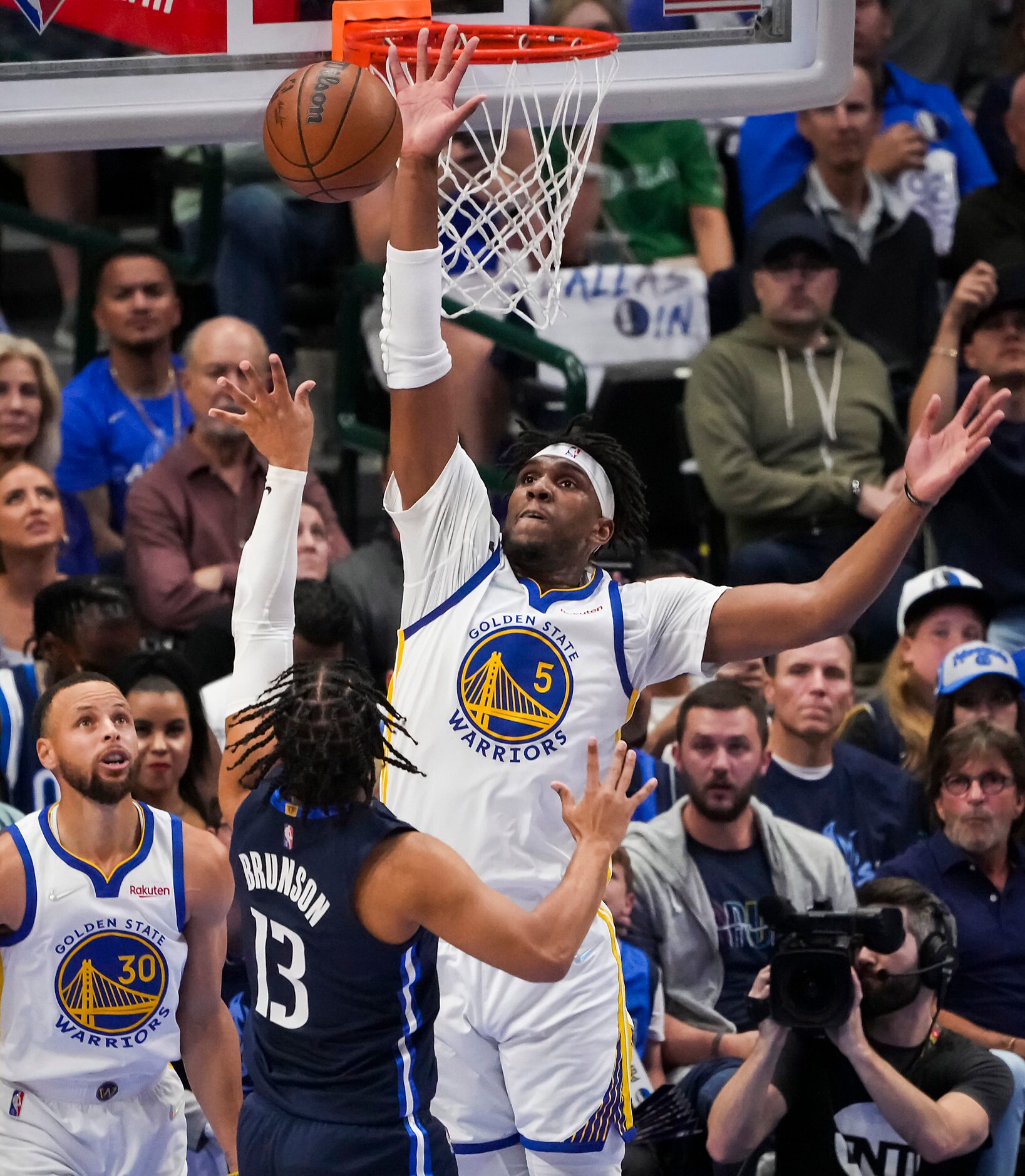 Dallas Mavericks guard Jalen Brunson (13) shoots as Golden State Warriors center Kevon...