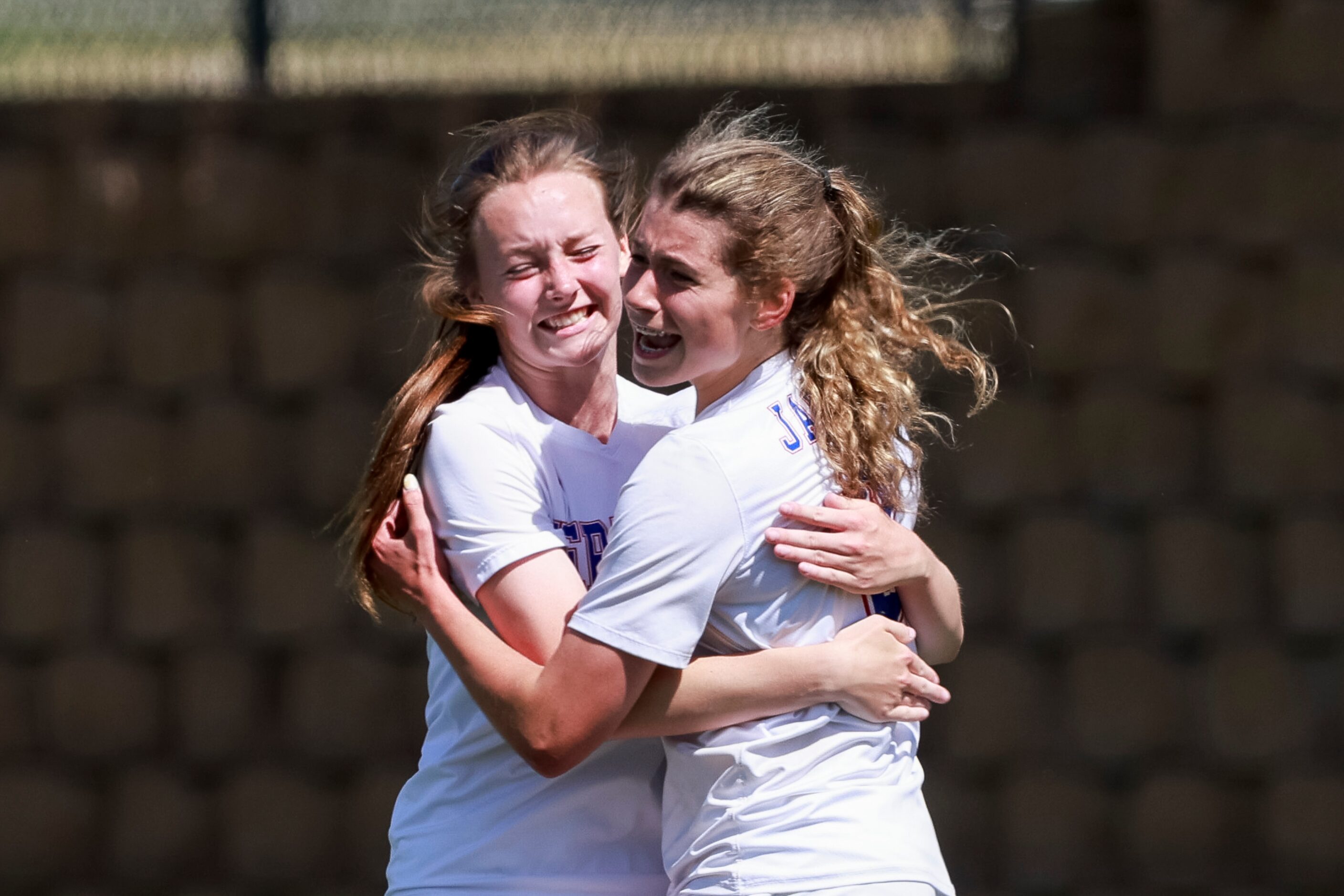 Midlothian Heritage midfielder Jules Burrows (right) celebrates her goal with Midlothian...