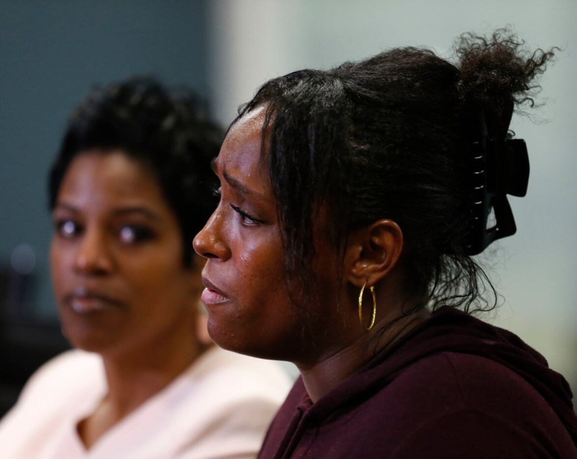 Latasha Nelson speaks during a news conference  alongside her two sons, Trayvon, 14, and...