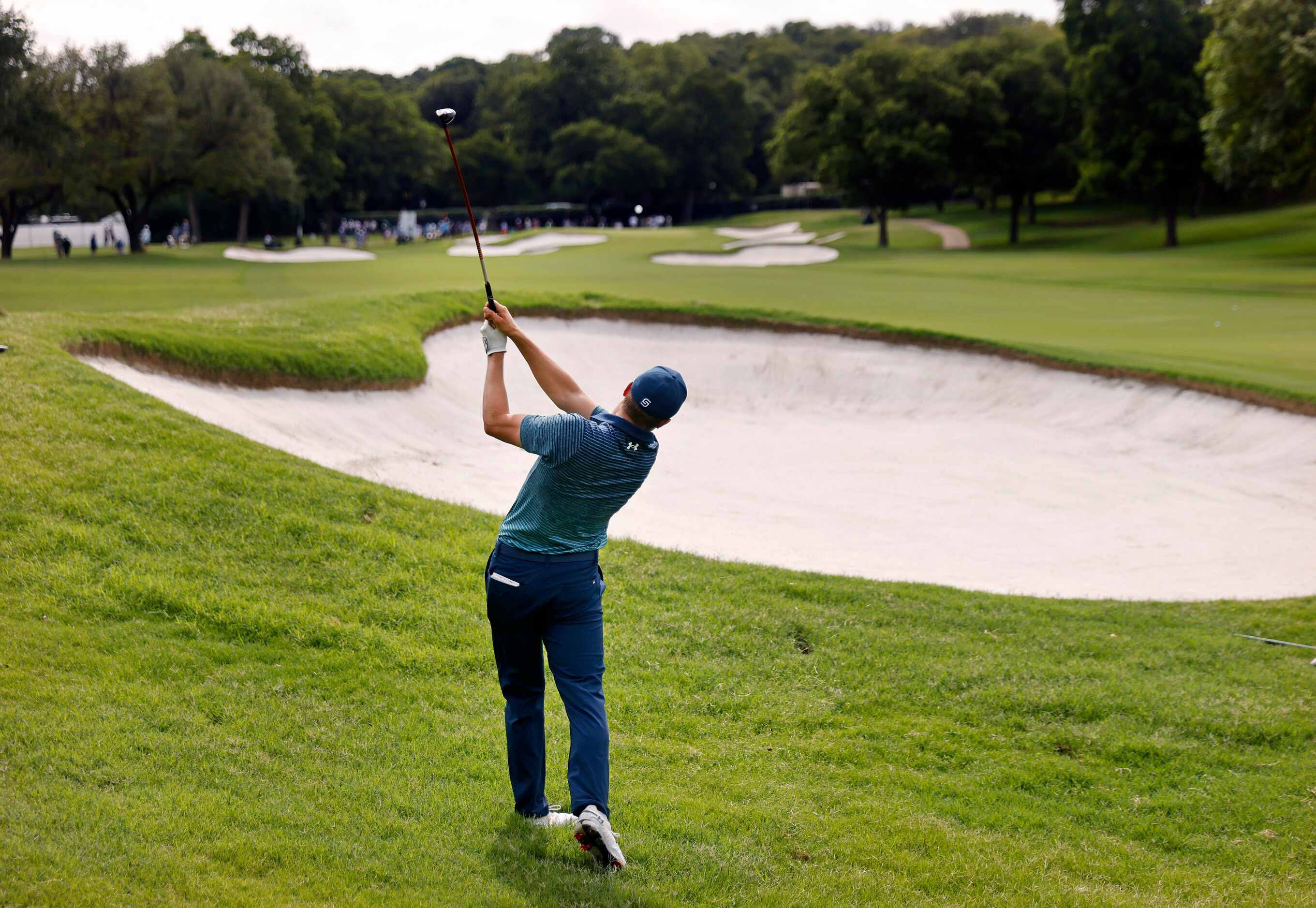 Professional golfer Jordan Spieth fires his second shot on the par-5, No.1 during round one...