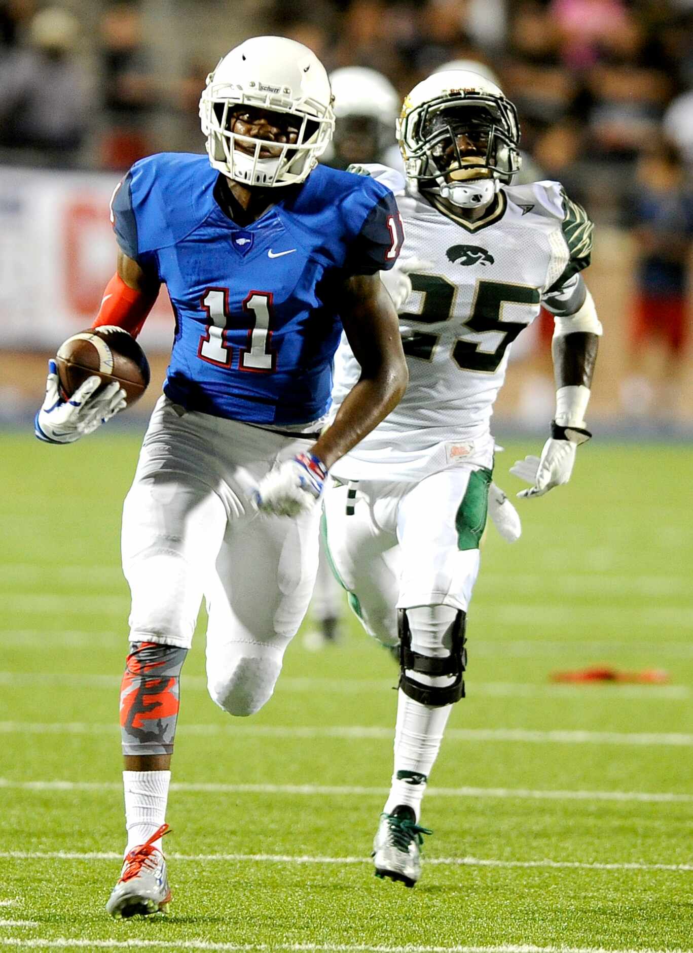 Allen's Lionel McConnell runs past Viera's Jay Boyd for a touchdown in the second quarter...