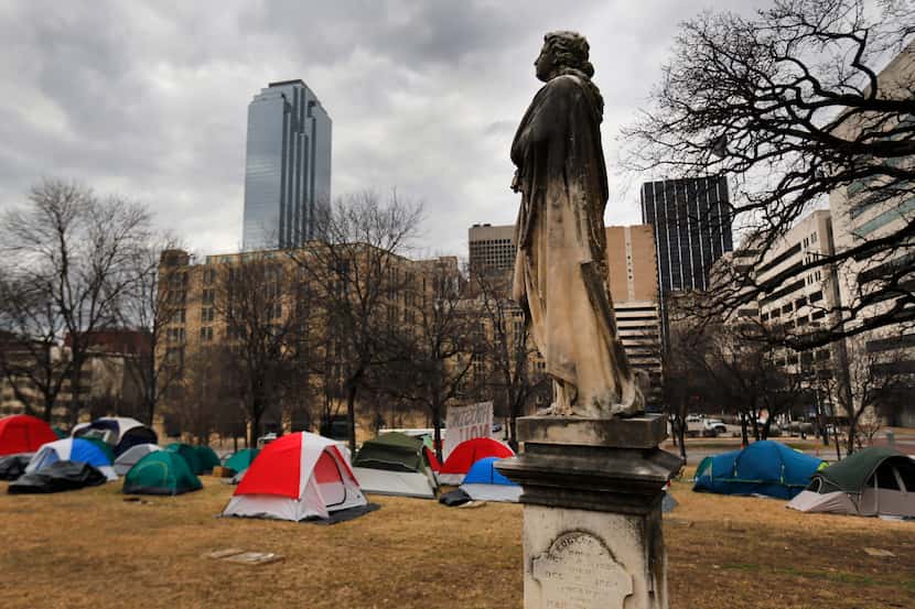 Between 30-40 people without housing setup their tents in Pioneer Park adjacent to the...