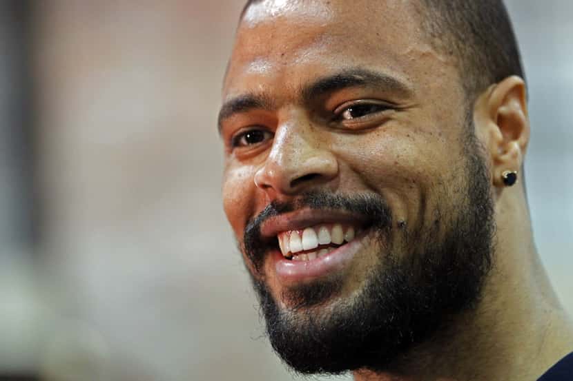 Dallas Mavericks center Tyson Chandler laughs with reporters during exit interviews Tuesday,...