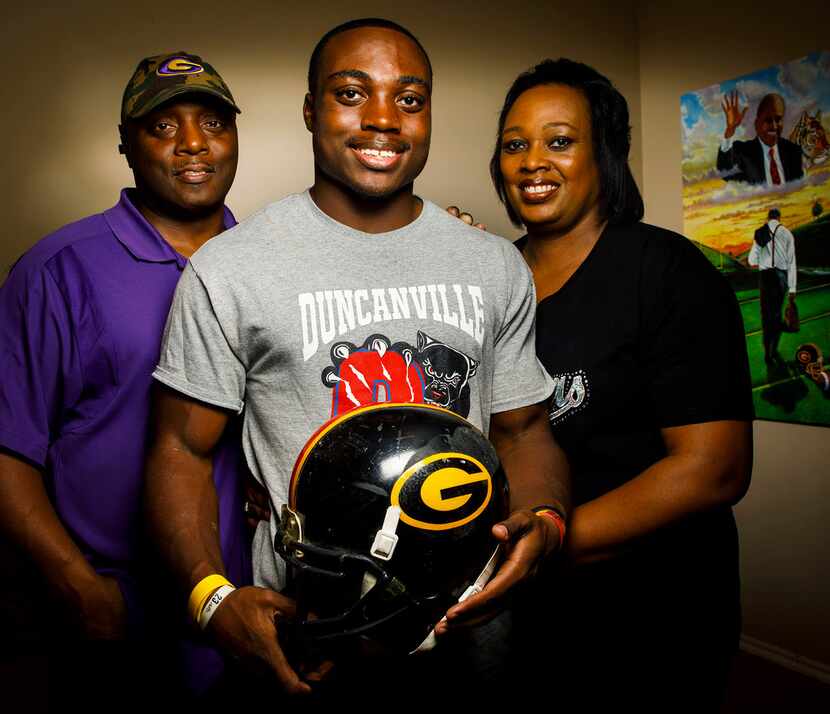 Duncanville running back Keilon Elder photographed at home with his father Ray Elder and...