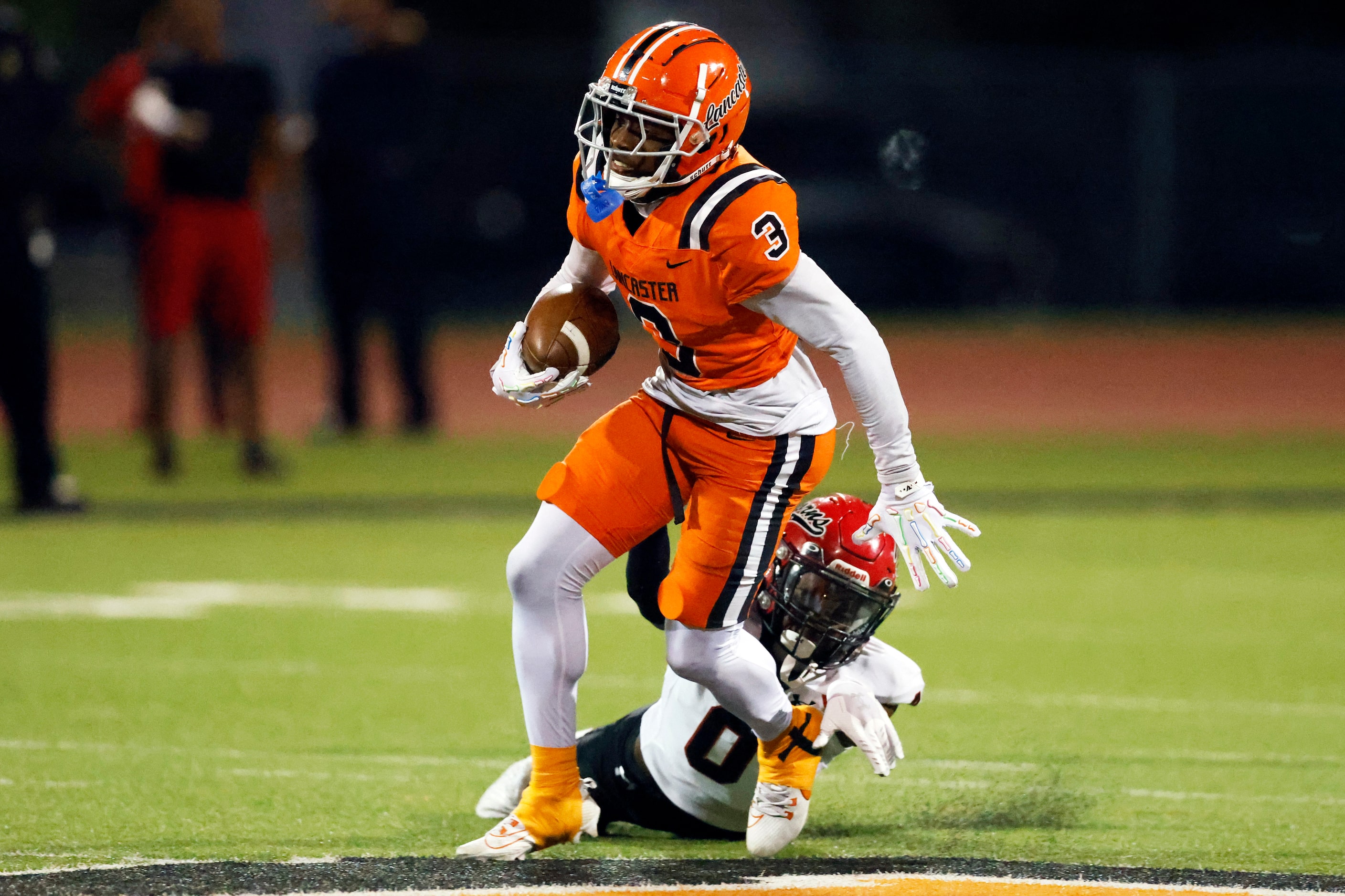 Cedar Hill defensive back Zane Good (0) slips off of Lancaster wide receiver Ja’Quavius...