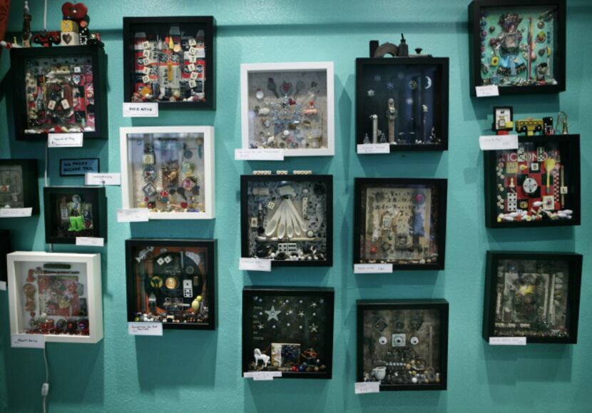 A display of artwork by shadowbox artist Laurie McClurg in her studio, photographed October...