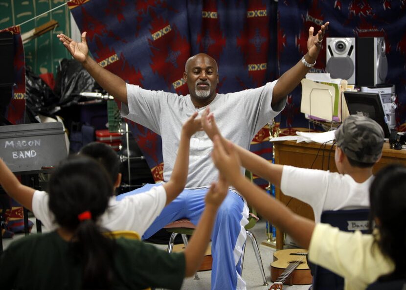 Osley Cook Jr., shown directing students during a 2011 summer camp, has dramatically...