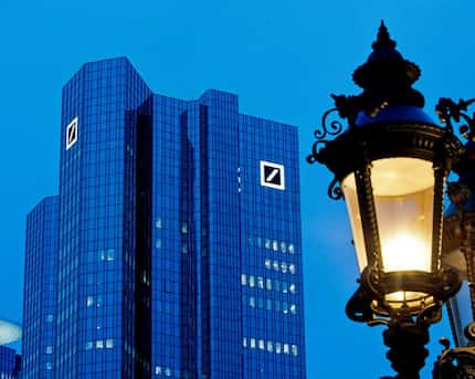 Deutsche Bank headquarters is seen behind a lamp in Frankfurt, Germany. President Donald...