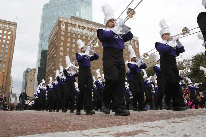 The TCU marching band performs in the Fort Worth Stock Show "All Western Parade" in downtown...