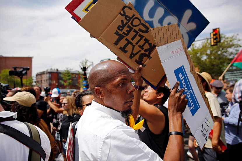 Signs were handed out during a Black Lives Matter march Tuesday in Philadelphia. The rally...