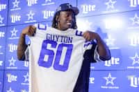 Dallas Cowboys first round draft pick Tyler Guyton poses for a photo at an NFL football news...