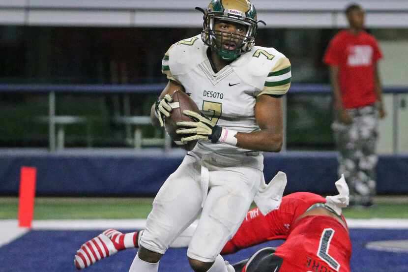 In one of the key plays of the game, DeSoto's 's Kolby Watts (7) returns a fumble for a...