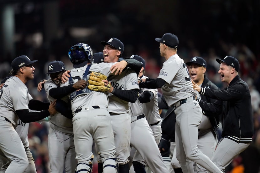 New York Yankees players celebrate after Game 5 of the baseball AL Championship Series...