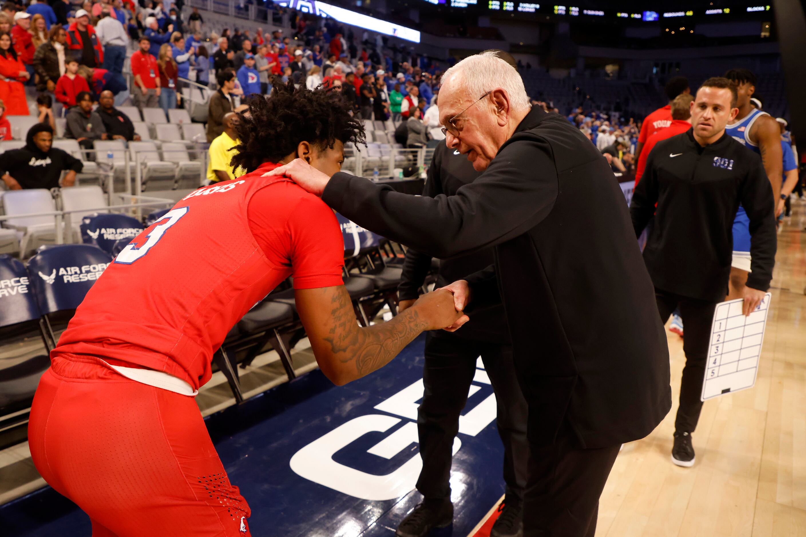 SMU guard Kendric Davis (3) is consoled by Memphis assistant coach Larry Brown after SMU...