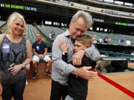  Ron Brand, a former scout for the Yankees, gave Tracen a hug Tuesday. (Tom Fox/Staff...