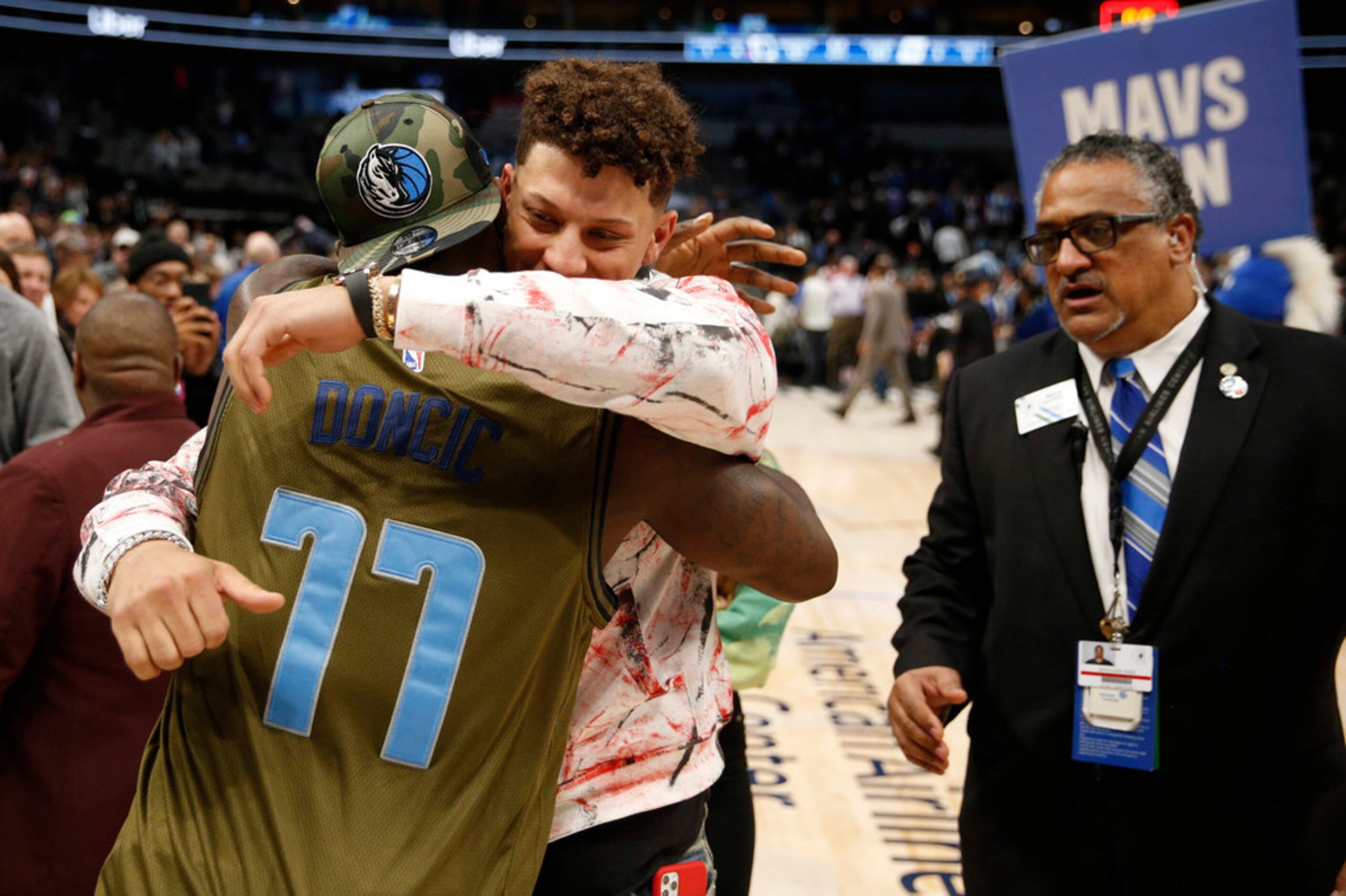 Former Dallas Cowboys player Dez Bryant hugs Kansas City Chiefs quarterback Patrick Mahomes...