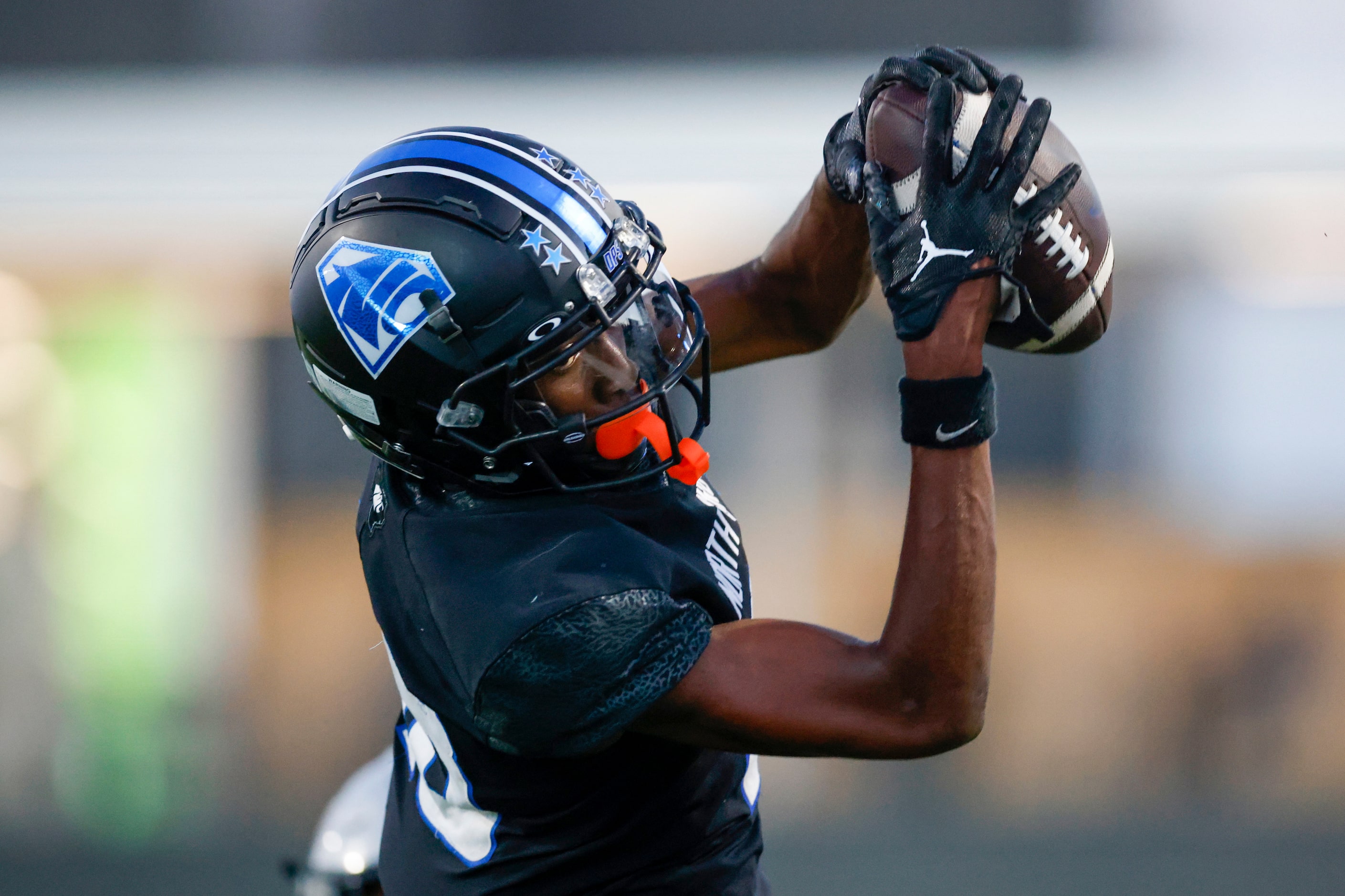 North Crowley wide receiver Jaidan Brooks (18) hauls in a pass for a touchdown during the...