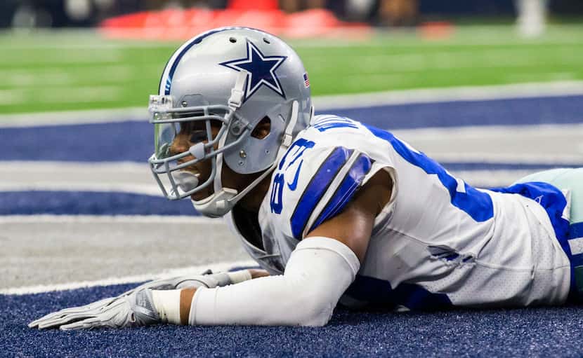 Dallas Cowboys wide receiver Terrance Williams (83) lays on the turf in the end zone after...