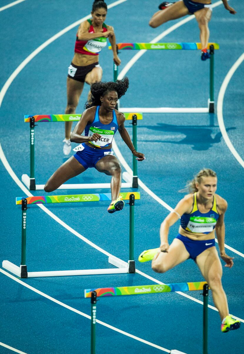 Ashley Spencer of the USA runs in a heat of the women's 400m hurdles at the Rio 2016 Olympic...